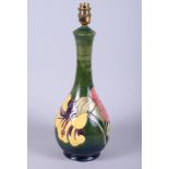 A Moorcroft pottery "Hibiscus" pattern table lamp, 16" high