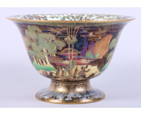 A Wedgwood Fairyland lustre porcelain bowl, designed by Daisey Makeig-Jones, the interior in "Woodland Elves" pattern and the