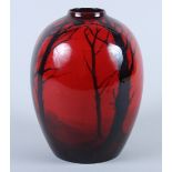 A Royal Doulton "Flambe" baluster vase, decorated cottage in a wood, 8 1/2" high