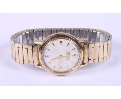 A Bulova Accutron wristwatch with gold plated and stainless steel case, white enamel dial with baton numerals, on associated 