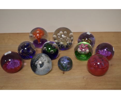A selection of paperweights, including Caithness inferno and splashdown, various colours and styles.