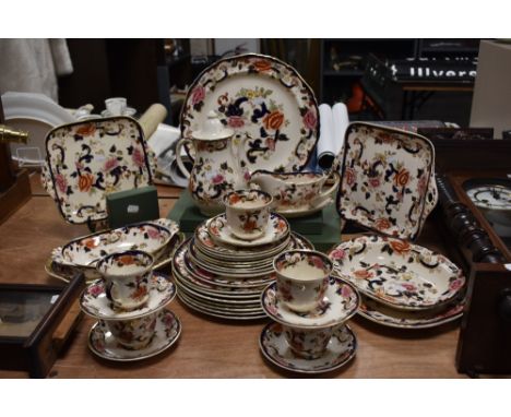 A large collection of Mason's Mandalay patterned tableware, including teacups, saucers, coffee pot, sandwich plates, and othe