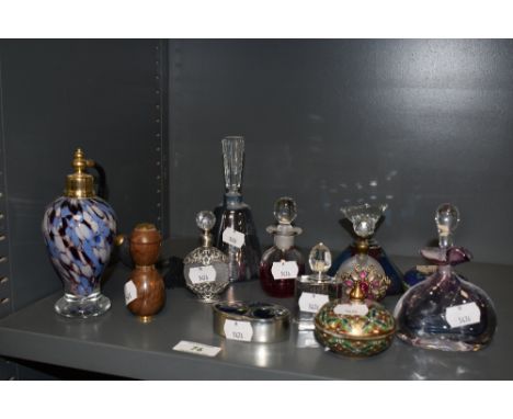 An assorted collection of art glass scent bottles, an atomizer of similar design, an A.E Williams pewter and enamel trinket b
