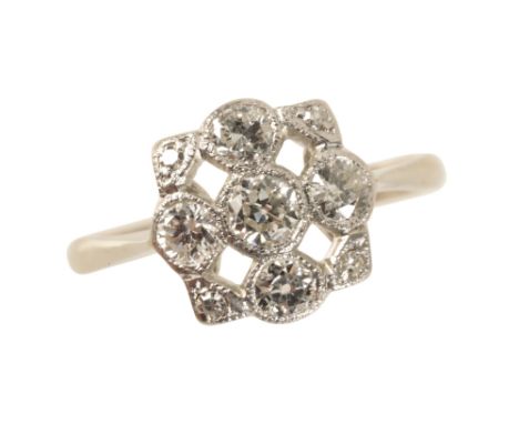 A DIAMOND CLUSTER RING, the openwork square panel set with old brilliant cut and eight cut diamonds, approximately 0.70 carat