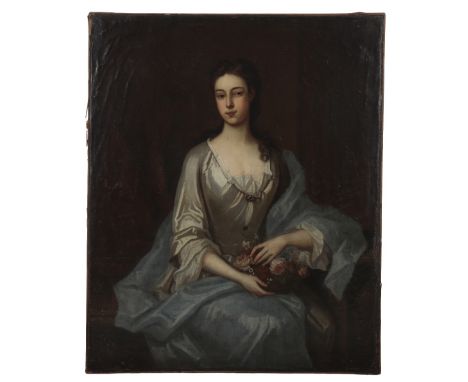 CIRCLE OF MICHAEL DAHL (1659-1743) A portrait of a woman, three-quarter length wearing a white silk dress with blue silk cloa