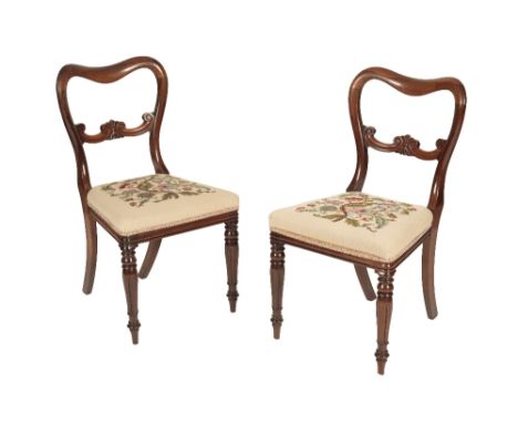 SET OF FOUR WILLIAM IV ROSEWOOD AND LATER TAPESTRY UPHOLSTERED DINING CHAIRS, circa 1835, the horizontal backsplats with carv
