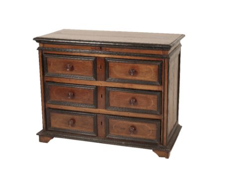 ITALIAN WALNUT AND EBONISED WOOD CHEST OF DRAWERS, the rectangular top with 'C.G.I.A. 1748' in marquetry within a cartouche, 