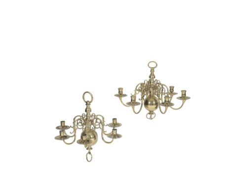 MATCHED PAIR OF ANGLO-DUTCH SIX LIGHT CHANDELIERS, early 18th century, the sockets and drip pans on scrolling branches held t