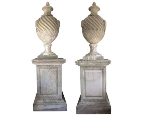 PAIR OF SUBSTANTIAL AND IMPOSING STONE COMPOSITION GARDEN URNS ON PLINTHS, second half 20th century, each with a shallow dome