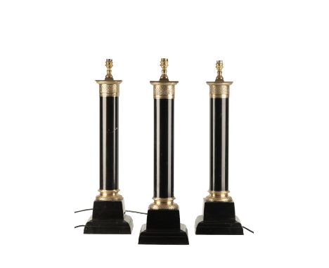 SET OF THREE BLACK PAINTED CAST IRON AND BRASS MOUNTED COLUMNAR TABLE LAMPS IN EMPIRE STYLE, the electrical fitments on squar