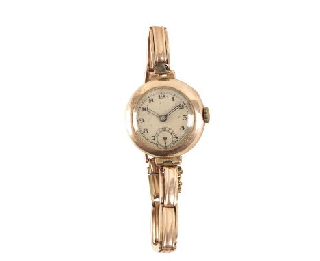 9CT GOLD LADIES BRACELET WATCH, circa 1940's, with manual wind movement, white dial, subsidiary seconds dial, black Arabic nu