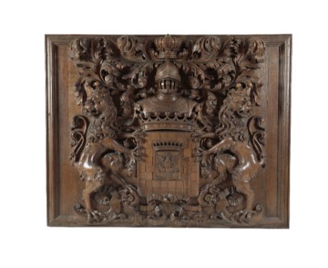 MAGNIFICENT AND SUBSTANTIAL PRUSSO-POLISH SCULPTED OAK ARMORIAL PANEL, early 19th century, the central shield with recessed r