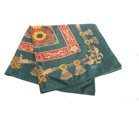 A Hermes 'Sunflowers' silk scarfThe emerald green ground scarf with sunflower design central panels, and further segmented fo