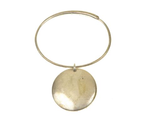 Georg Jensen: A silver 'Zero' bangleThe tapered bangle with a silver disc attached, no. 450 M, designed by Jaqueline Rabun, s