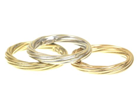 A set of three 18k tri-coloured gold bandsIn manner of Cartier, each ring of twist reeded design, gross weight 6.6g, ring siz