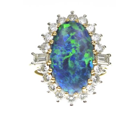 Boodles: An exceptional black opal and diamond cluster ringCentering an elongated black opal, within a round brilliant cut di