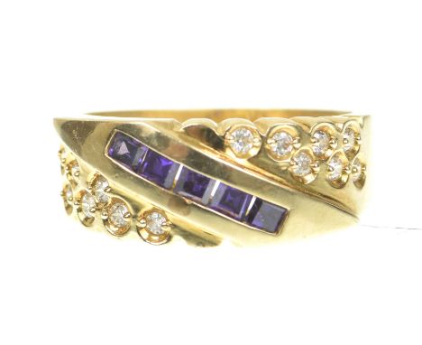 An amethyst and cubic zircona dress ringThe diagonally set calibre cut amethysts flanked by circular shape cubic zirconia, mo