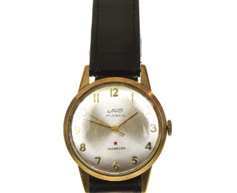 A 9k gold UN5 manual wind wristwatchThe signed silvered dial with applied Arabic numerals, central seconds hand and gold tone
