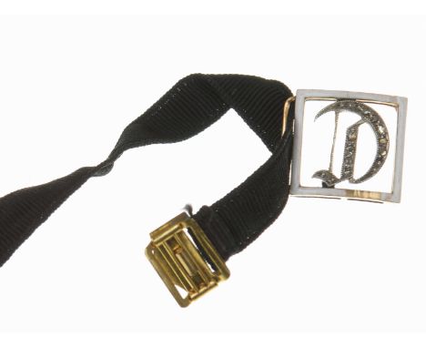 A Victorian enamel and diamond initial mourning braceletThe 'C' initial set with rose cut diamonds within a white enamel squa