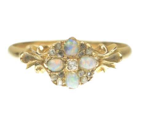 A late 19th/early 20th Century opal and diamond cluster ringCentering an old cut diamond within a cabochon opal and old cut d