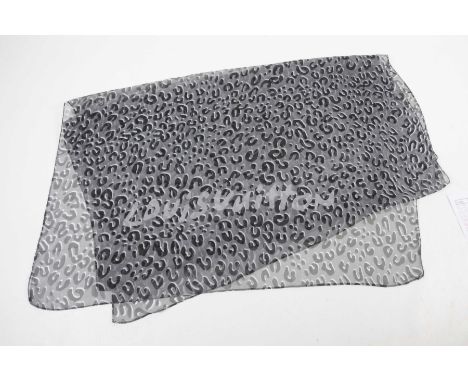 A Louis Vuitton 'Animal' silk scarfThe slender grey ground scarf with black and white print marks, and grey text 'Louis Vuitt