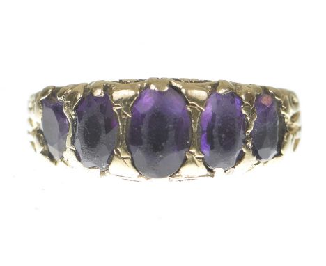 An amethyst five stone ringThe graduated oval shape amethysts modelled in 9k gold, gross weight 4.3g, ring size N