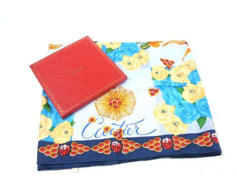 A Cartier 'Rubies'  ladies silk scarfThe vibrantly coloured scarf detailed with flowers, jewellery and gem stones, before pan