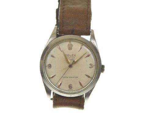 Rolex: A vintage Oyster Perpetual stainless steel manual wind wristwatchThe signed white textured dial with rose tone tapered