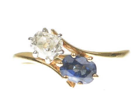 A sapphire and diamond 'Toi et Moi' ringCentering an old mine cut diamond and an oval shape sapphire to a twist setting, mode