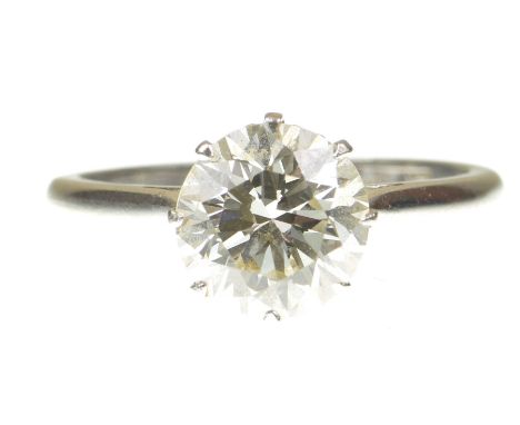 A diamond single stone ringThe round transitional cut diamond, claw set, to a precious metal shank stamped PLAT, diamond weig