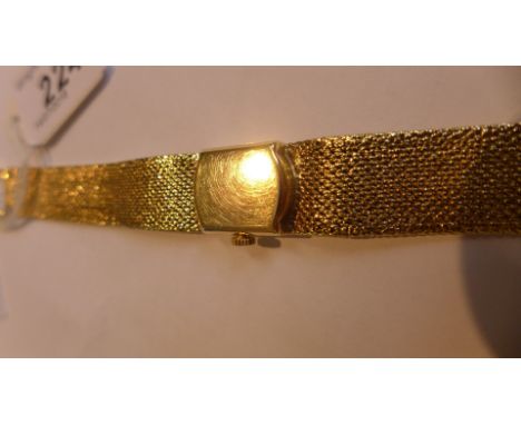 Omega: A ladies 9k gold manual wind bracelet watchThe signed square dial, with applied gold baton hour markers, black hands, 
