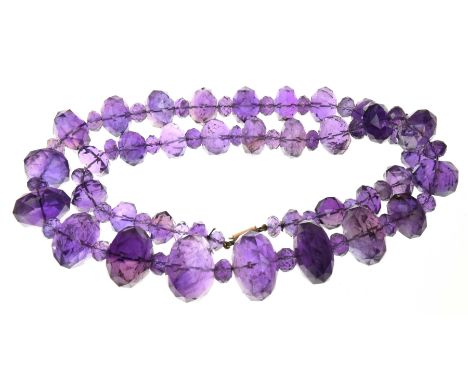 An amethyst bead necklaceThe graduated faceted amethyst beads with smaller alternate amethyst beads, to a rose metal clasp, l