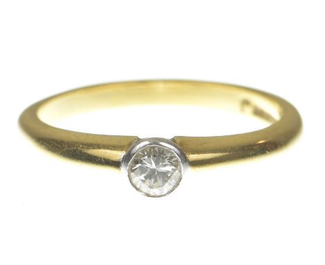 A diamond single stone ringThe bezel set round brilliant cut diamond to an 18k gold shank, diamond weight approx. 0.20ct, gro