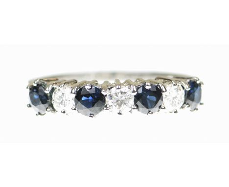 A sapphire and diamond half hoop ringSet with alternate round brilliant cut diamonds and circular shape sapphires, modelled i