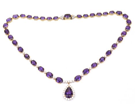 An impressive amethyst and diamond riviere neckletComposed of thirty seven graduated oval shape amethysts, claw set, with alt