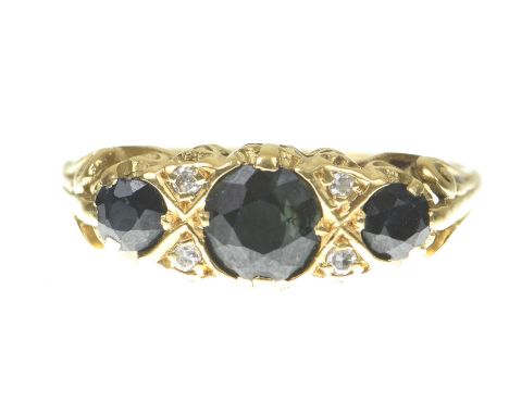 A sapphire and diamond ringThe graduated circular shape sapphires with diamond highlights, to a pierced gallery and scroll sh