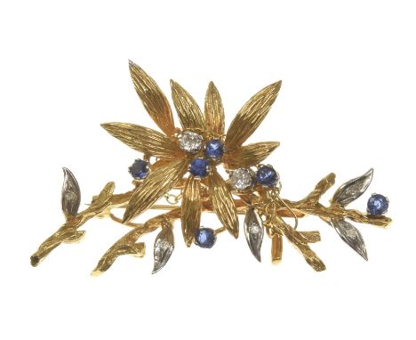 A sapphire and diamond spray broochThe round brilliant cut diamonds and circular shape sapphires set to a foliate bi-coloured