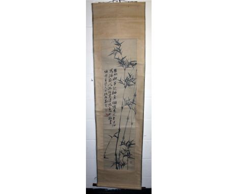 A CHINESE HANGING SCROLL PICTURE, decorated with calligraphy and bamboo, the picture itself 52.5in x 13in.