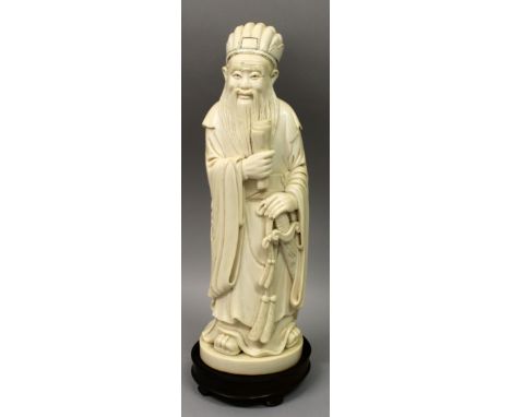 A LARGE GOOD QUALITY 19TH/20TH CENTURY CHINESE CARVED IVORY FIGURE OF A SAGE, weighing 1.73Kg, together with a wood stand, th