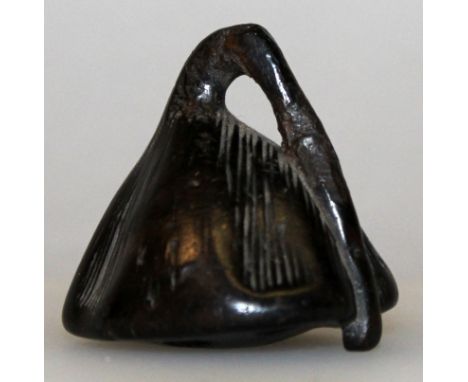 A JAPANESE WOOD NETSUKE OF A LOTUS POD, naturalistically engraved, 1.4in high.