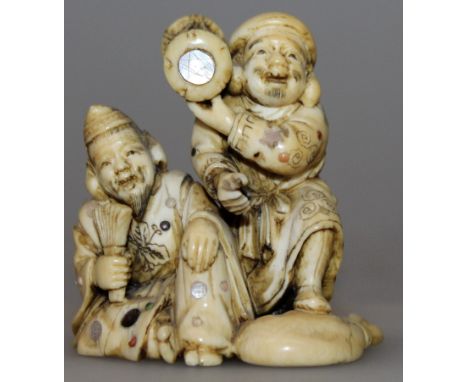 A GOOD SIGNED JAPANESE MEIJI PERIOD SHIBAYAMA & IVORY NETSUKE OF EBISU & DAIKOKU, the robes of each deity inlaid in mother-of