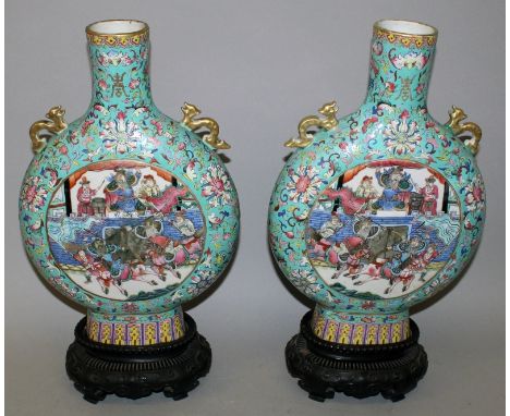 A GOOD LARGE PAIR OF 19TH CENTURY CHINESE CANTON FAMILLE ROSE PORCELAIN MOON FLASKS, together with fitted carved wood stands,