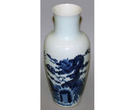 A CHINESE BLUE & WHITE PORCELAIN VASE, decorated with dragons above stylised waves, the base with a six-character Kangxi mark