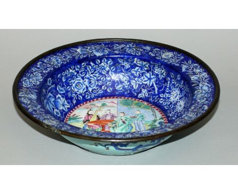 A 19TH CENTURY CHINESE CANTON ENAMEL BOWL, the interior decorated to its centre with a group of mandarins listening to a lady