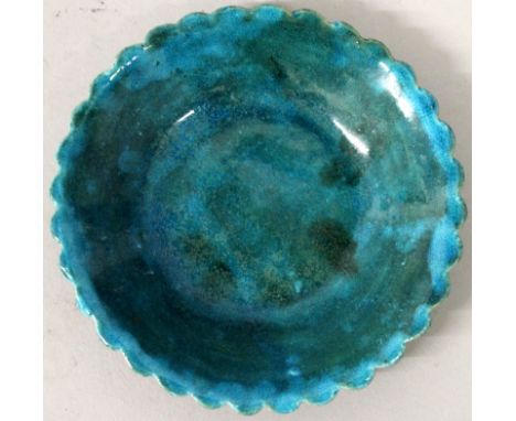 A SMALL CHINESE KANGXI PERIOD TURQUOISE GLAZED PORCELAIN DISH, the underside rim with a moulded lappet design, the base ungla