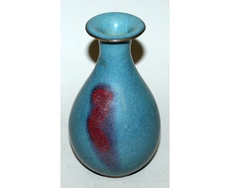 A CHINESE JUN WARE PURPLE SPLASH CERAMIC VASE, the body of pear form, 6.75in high.