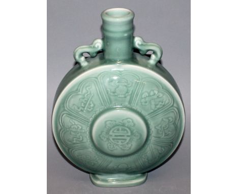 A LARGE CHINESE CELADON PORCELAIN MOON FLASK, each surface centred by a Shou medallion encircled by ribboned Buddhist emblems