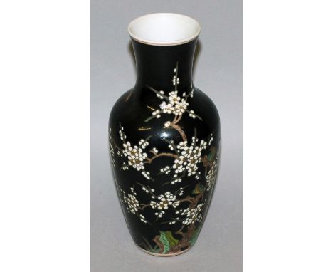 A CHINESE FAMILLE NOIRE PORCELAIN VASE, decorated with birds perched on a blossoming branch, the base with a six-character Ka