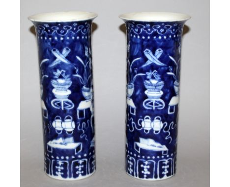 A PAIR OF 19TH CENTURY CHINESE BLUE & WHITE PORCELAIN VASES, each cylindrical body painted with vases, censers, ribboned embl