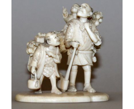 A GOOD QUALITY SIGNED JAPANESE MEIJI PERIOD IVORY OKIMONO OF A WOODCUTTER & HIS SONS, the man holding an axe and bearing a bu